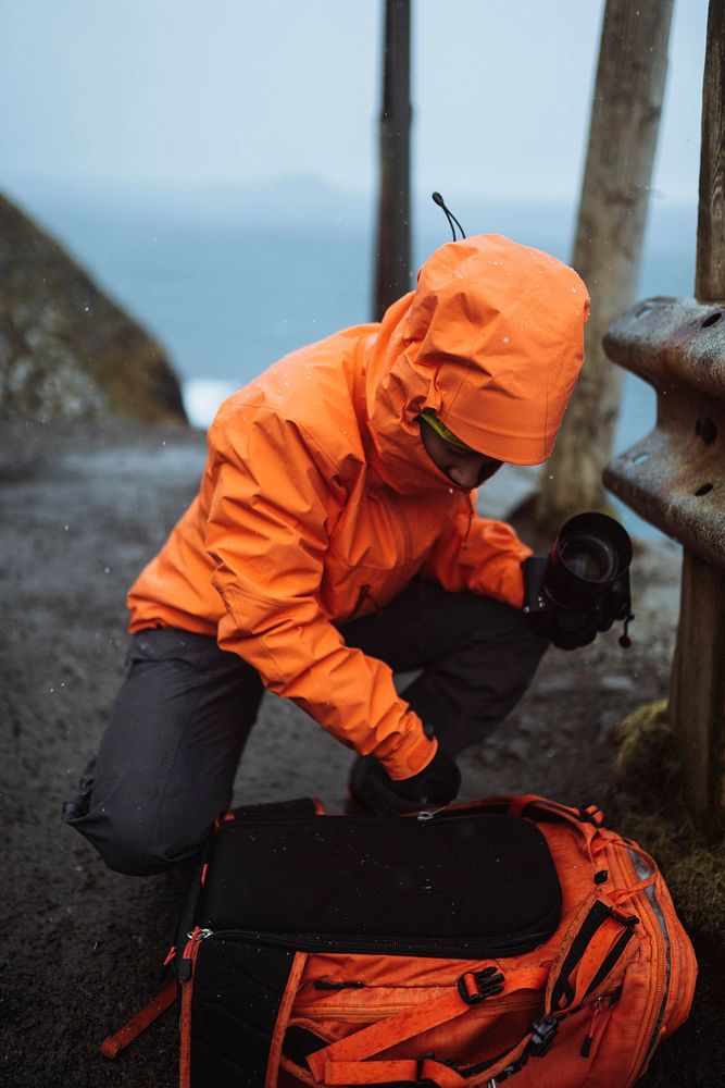 Photographer preparing a camera for a shoot at the Faroe Islands, part of the Kingdom of Denmark