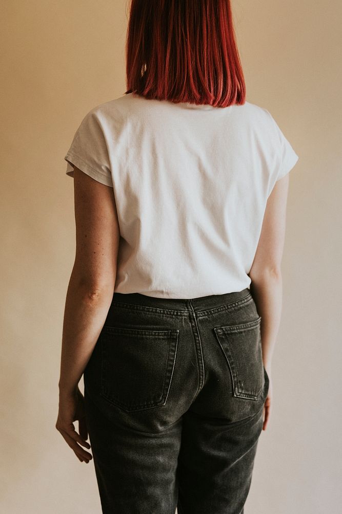 Women's white t-shirt black jeans studio shot