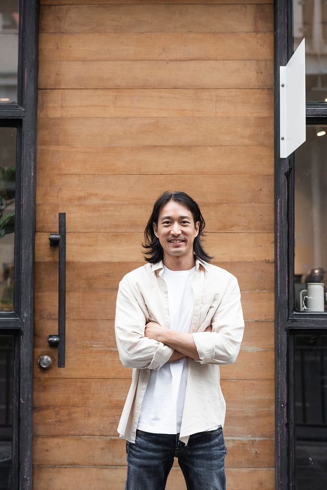 Japanese barista and owner outside his coffee shop