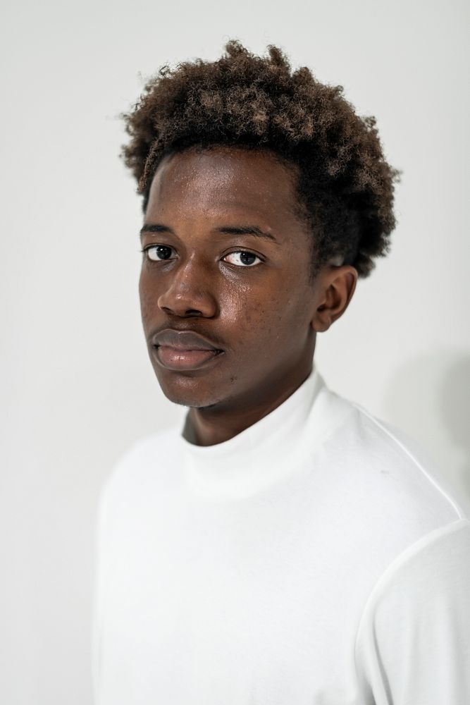 Young african american man in white polo shirt portrait
