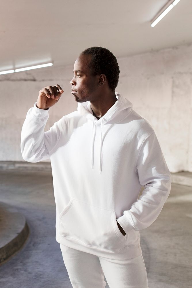 Man in white hoodie and sweatpants men&rsquo;s fashion apparel outdoor shoot