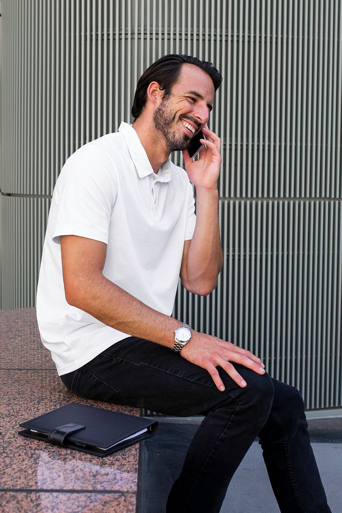White polo shirt mockup psd man talking on the phone menswear apparel fashion
