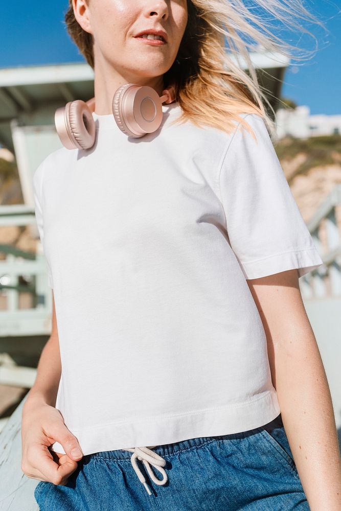 Blonde woman in white tee at the beach