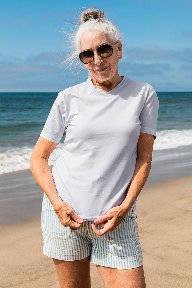 White t-shirt apparel psd mockup senior woman fashion shoot at the beach