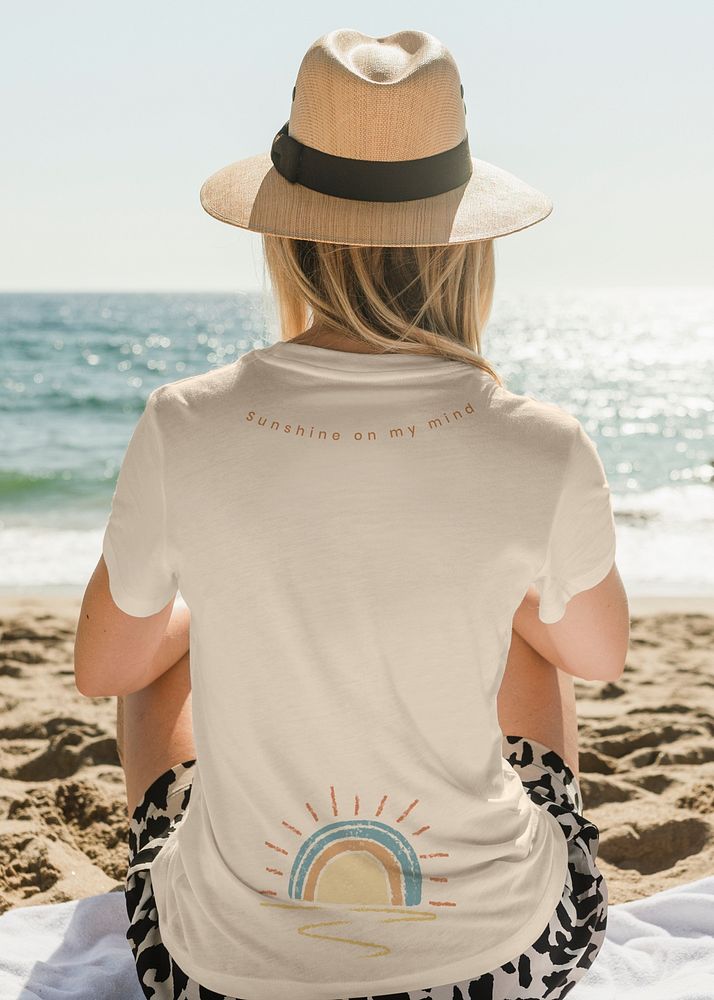 Beige t-shirt mockup psd with sunset print beach apparel shoot