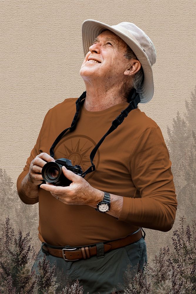 Senior man appreciating the beauty of nature with brown background