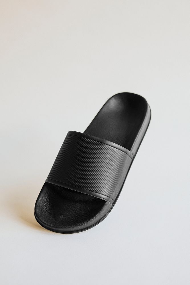 Black rubber flip flops slipper on gray