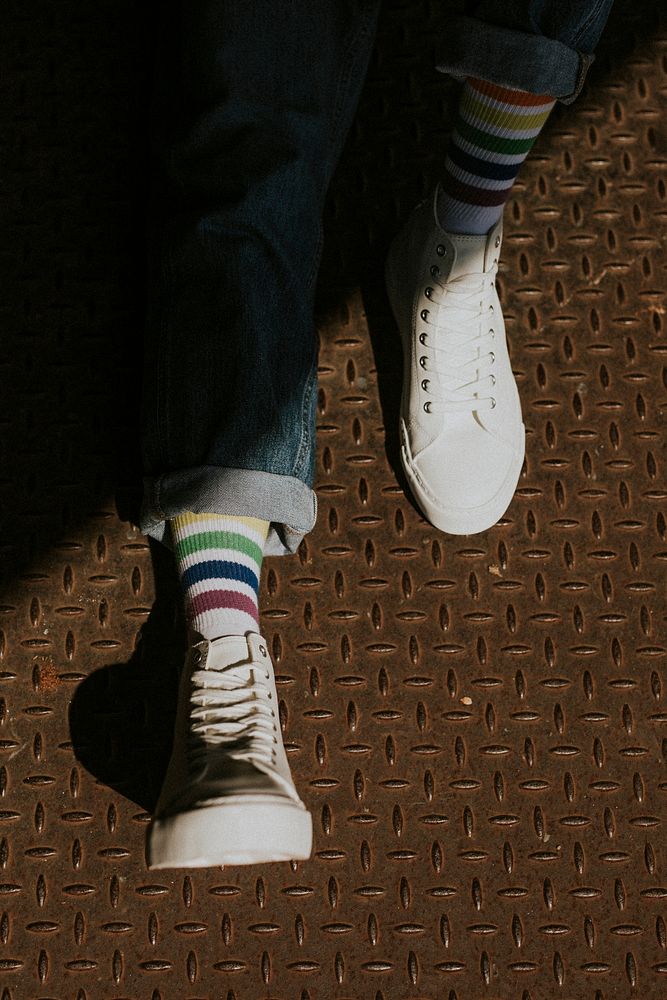 Man legs in white canvas sneakers
