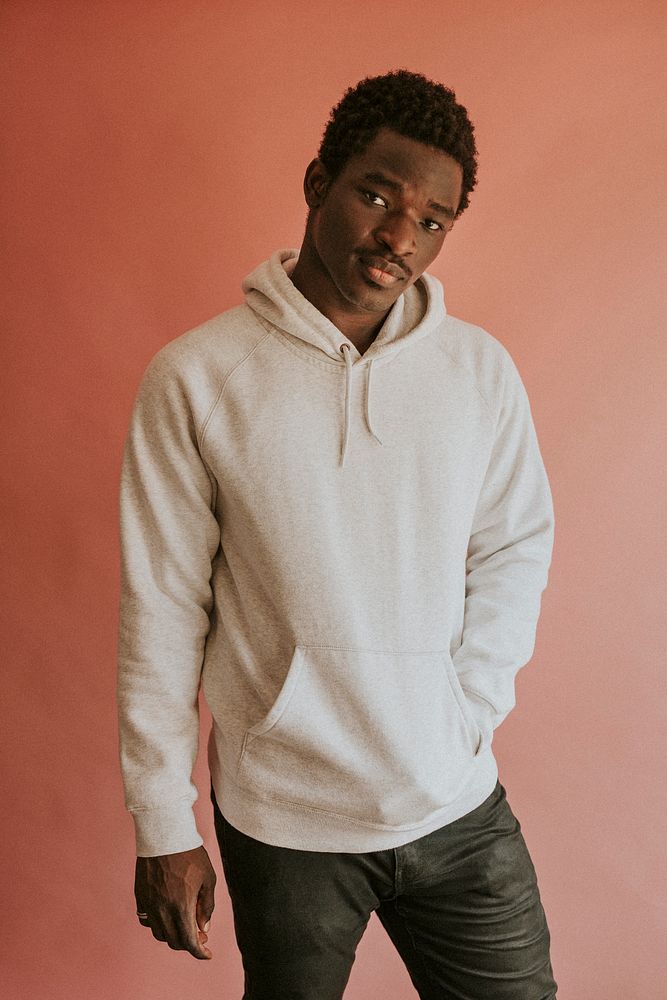 Black man in white hoodie mockup on pink background