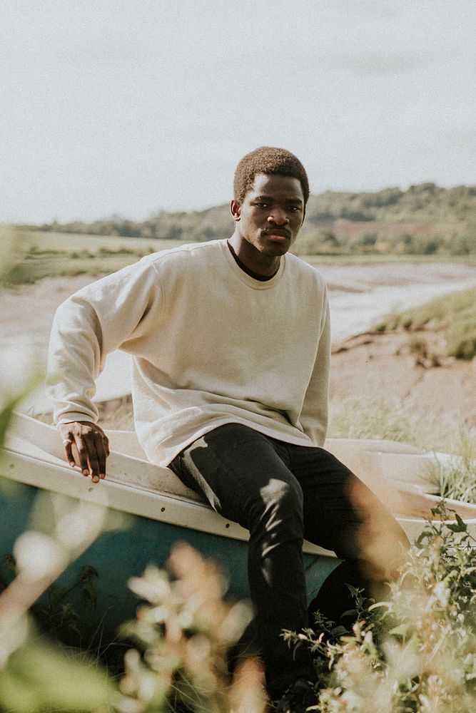 White college sweater mockup male model outdoor shoot psd