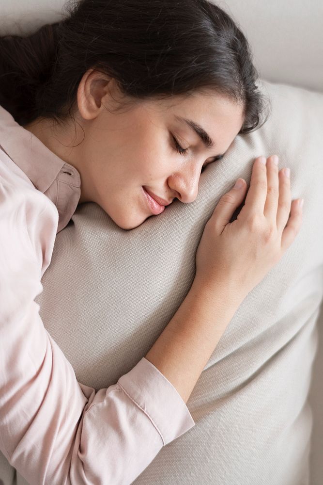 Woman sleeping comfortably on her pillow