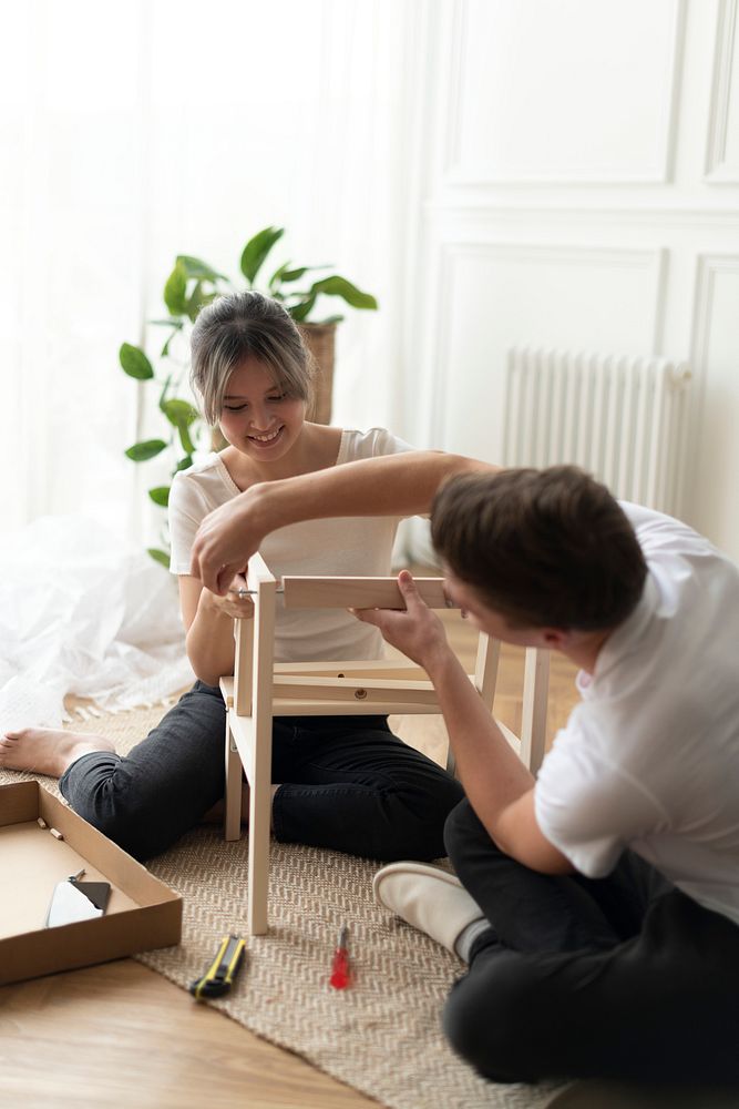 Couple assembling a diy chair from scratch