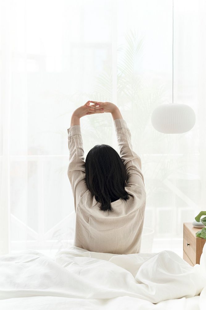 Woman starting her morning with a stretch