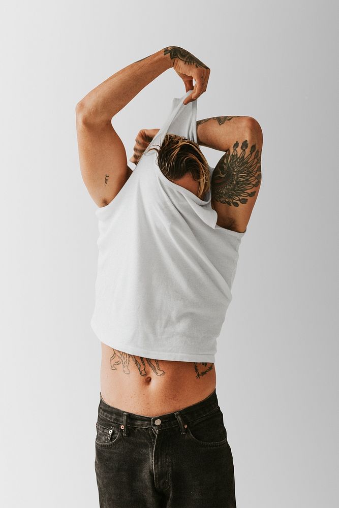 White tank top mockup psd on a cool arsty looking man