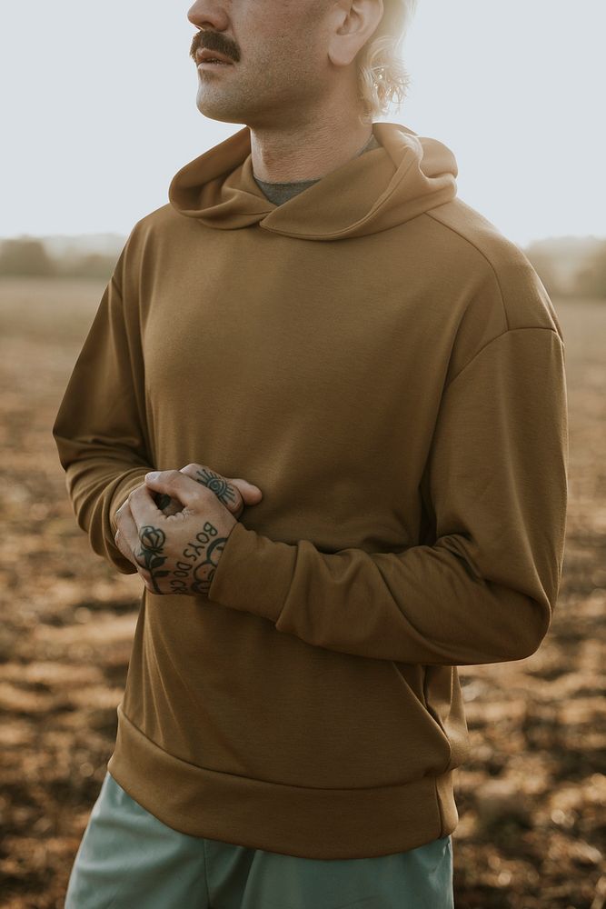 Hoodie mockup psd with man standing outdoors