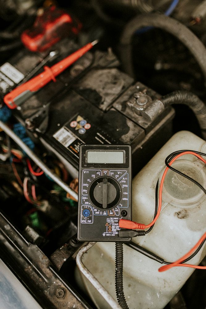 Voltage meter used to repair a car