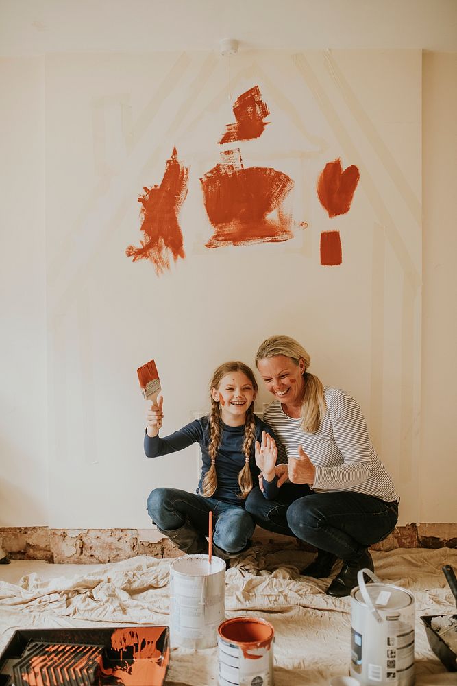 Mother and daughter home painting