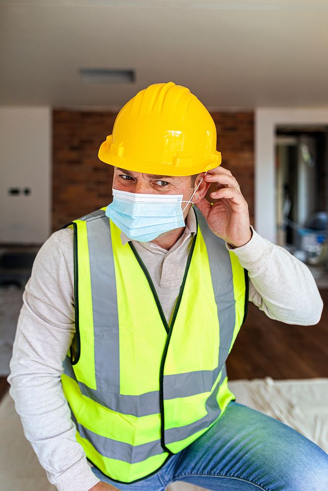 Contractor remodeling a home in the new normal