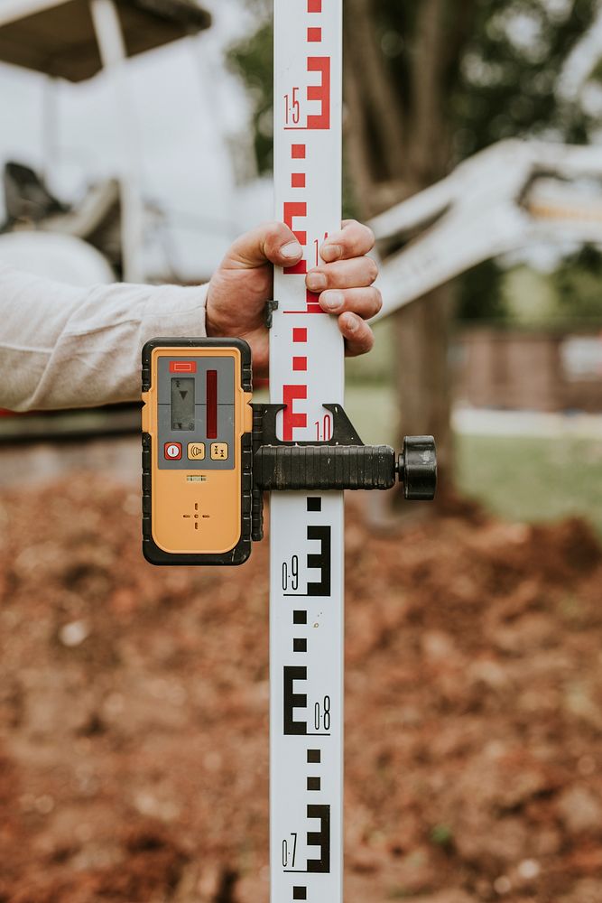 Land surveying tool used by a construction worker