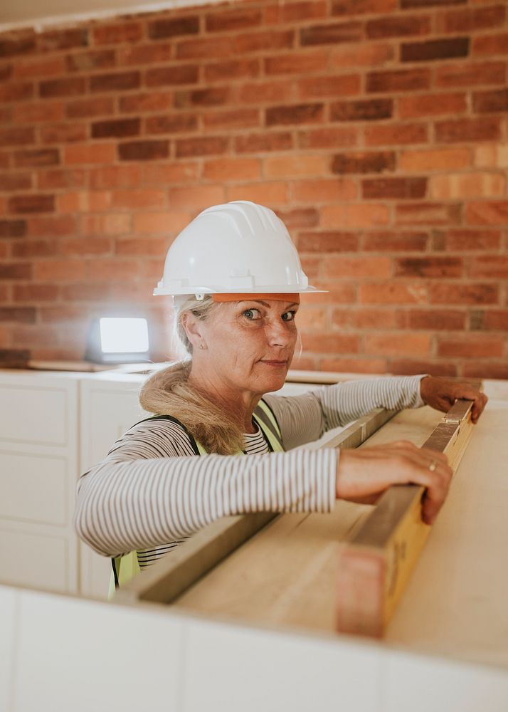 Middle aged woman remodeling her home