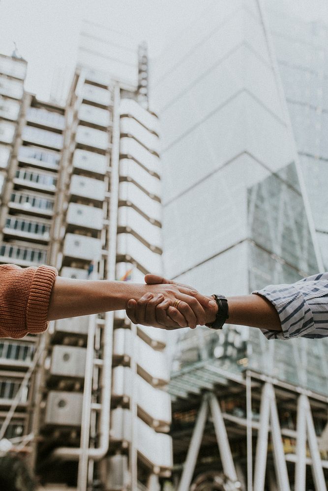 People holding hands, business handshake