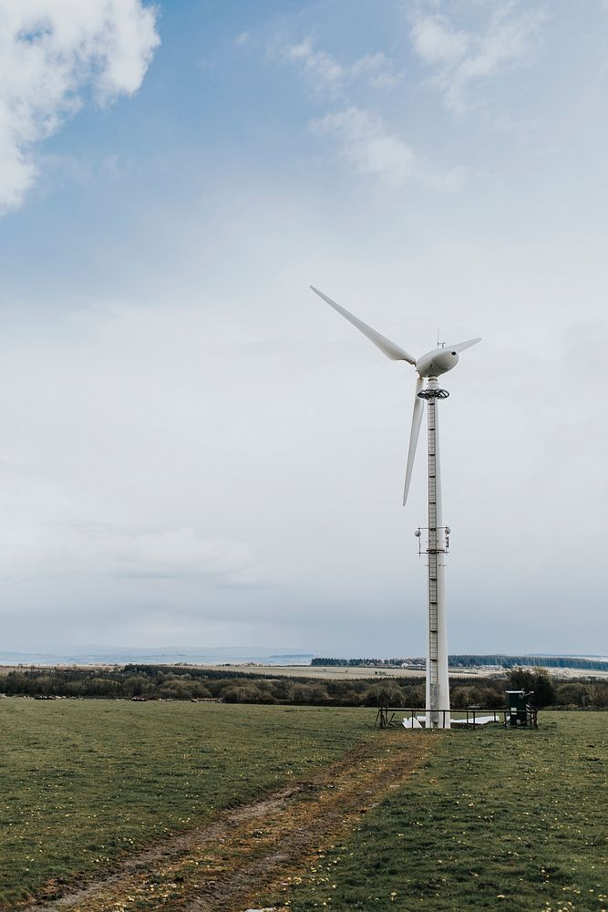Wind turbine under blue sky renewable energy environmental campaign