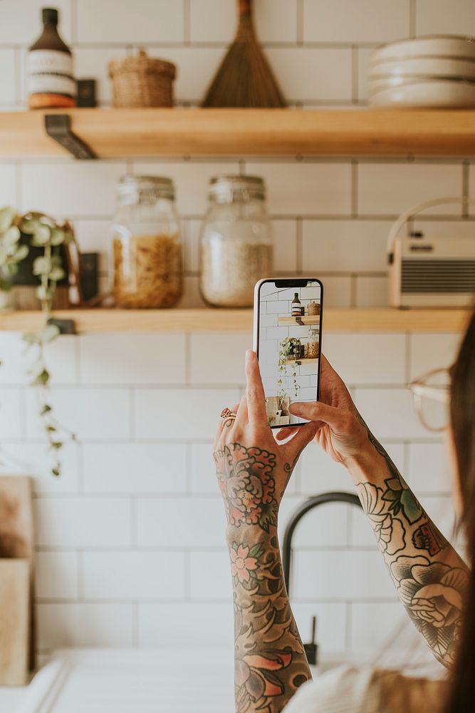 Lifestyle blogger taking a photo of kitchen home decor