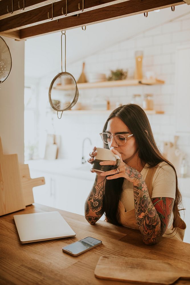 Woman sipping tea to relax afterwork while WFH