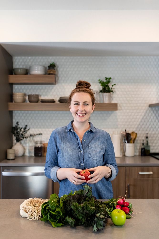 Woman with healthy vegetables in a kitchen