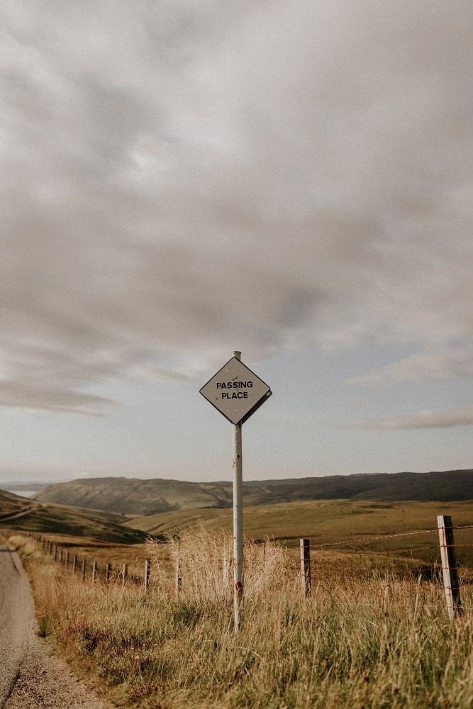 Animal crossing in Scottish countryside, passing place sign