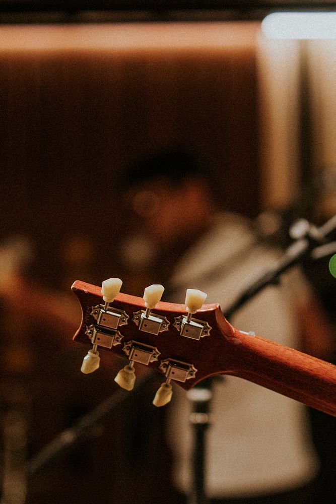 Musician playing guitar background, aesthetic photography