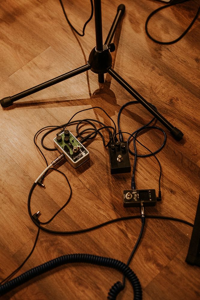 Aesthetic music studio equipment, audio interface on the floor