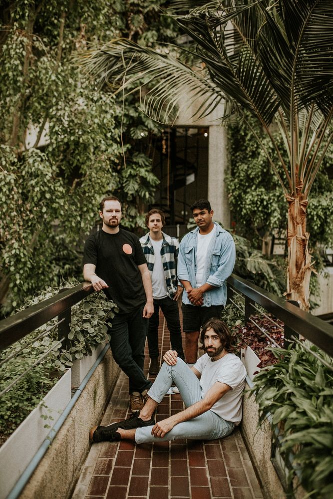 Men posing in garden, botanical greenhouse photoshoot 