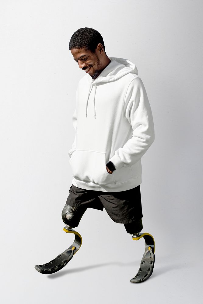 Male athlete with prosthetic leg wearing white hoodie