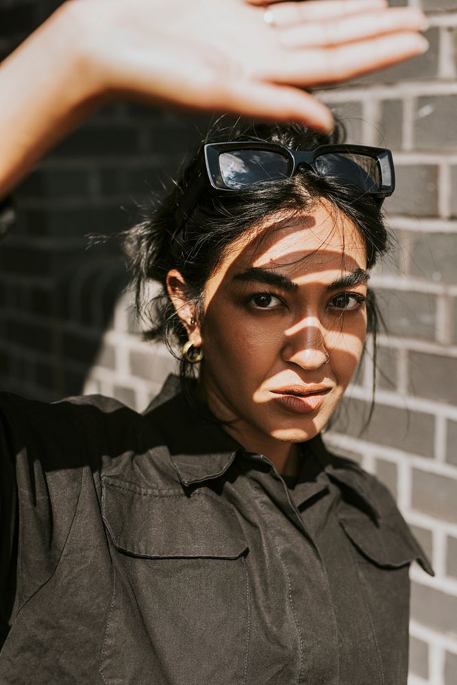 Indian woman fashion shoot by the brick wall 