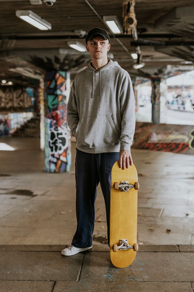 Cool man with yellow skateboard | Premium Photo - rawpixel