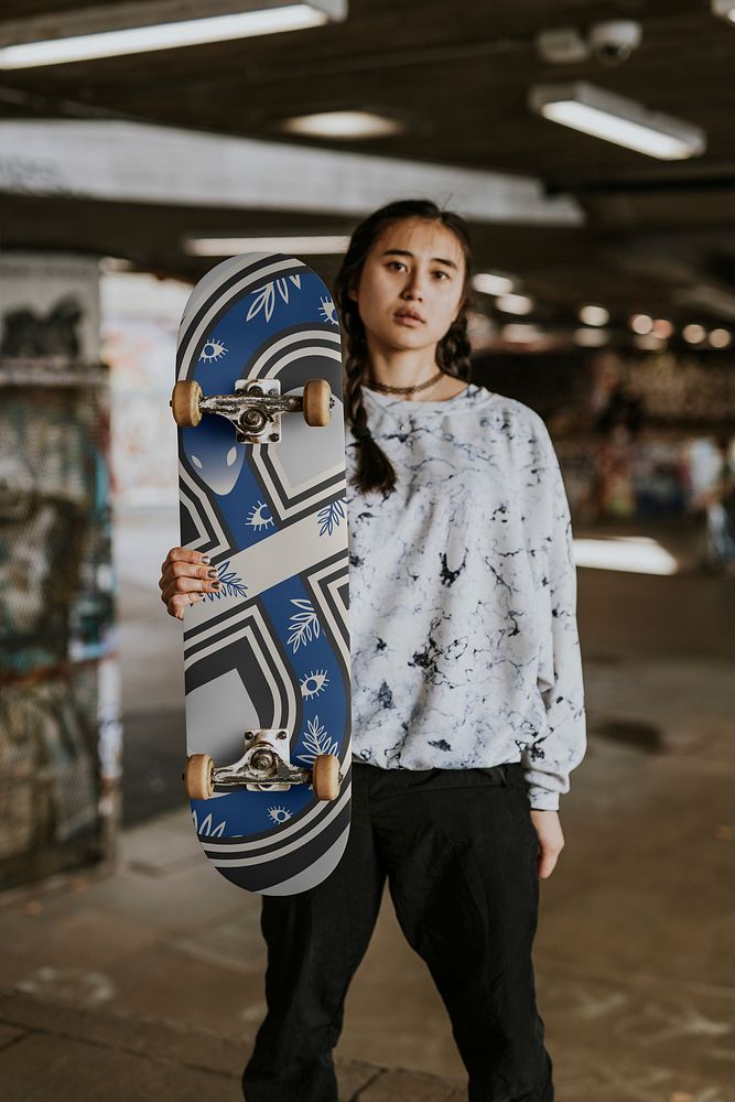 Cool Asian woman with blue skateboard