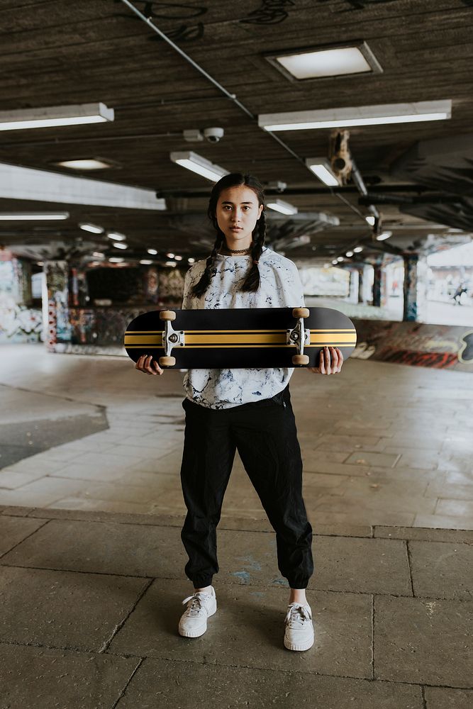 Cool woman with black skateboard