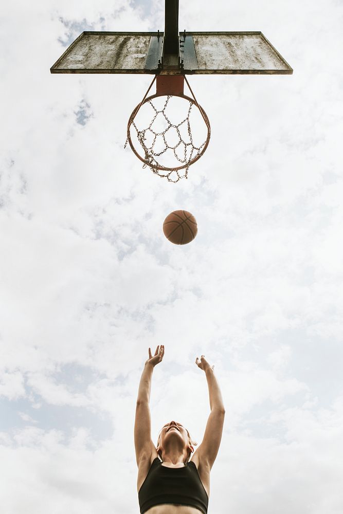 Sport background, young girl playing basketball, summer hobby