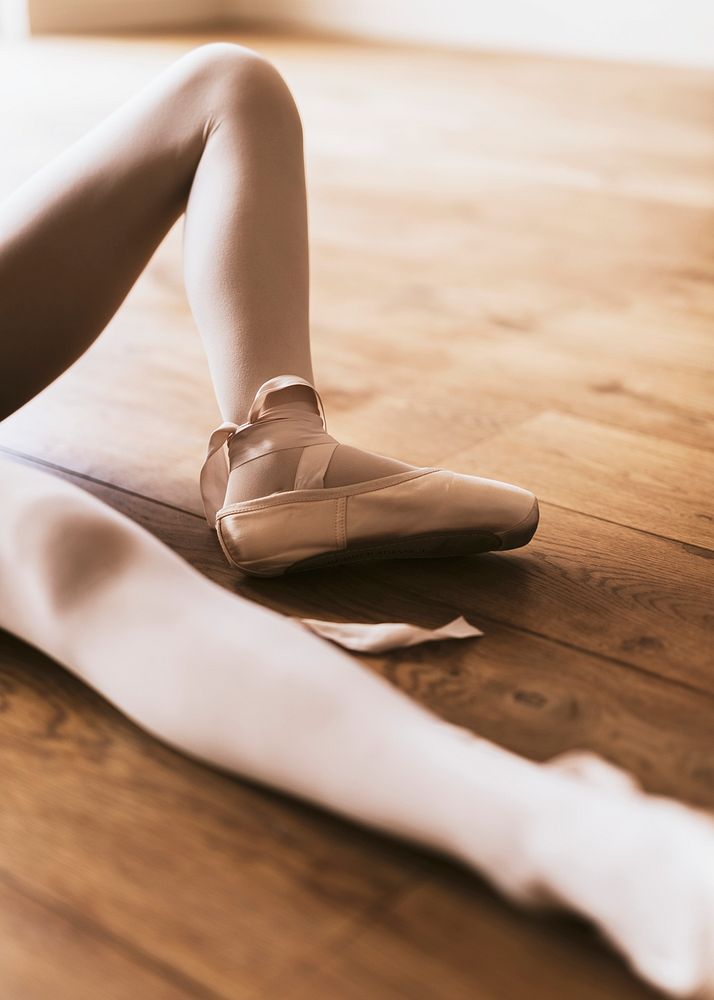 Ballerina background, girl sitting on wooden floor