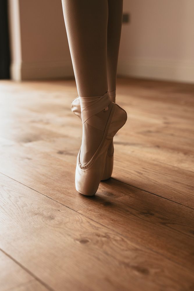 Ballerina background, releve pose, wooden floor