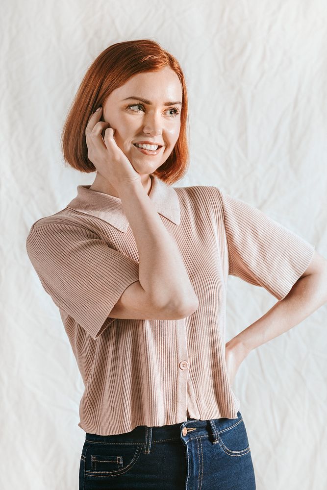 Cheerful woman in brown knitted shirt