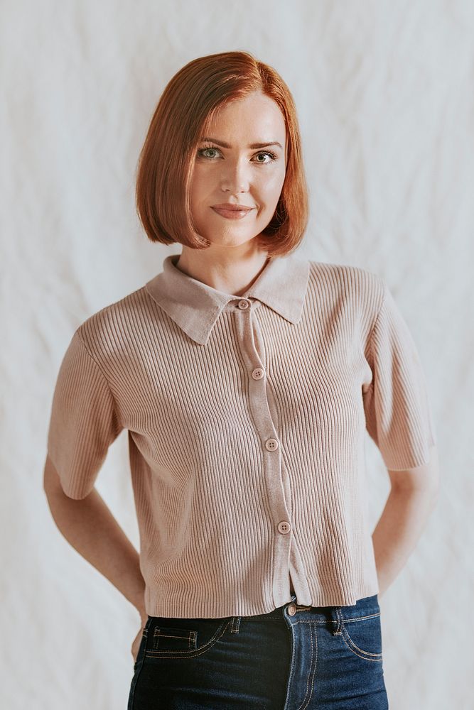 Happy woman in beige knitted shirt, portrait