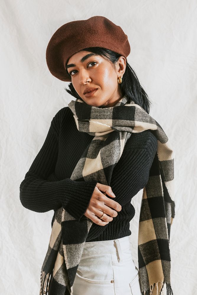 Woman wearing brown beret and plaid scarf, autumn apparel fashion design