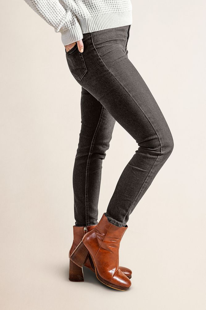 Woman in black jeans and leather boots, autumn fashion