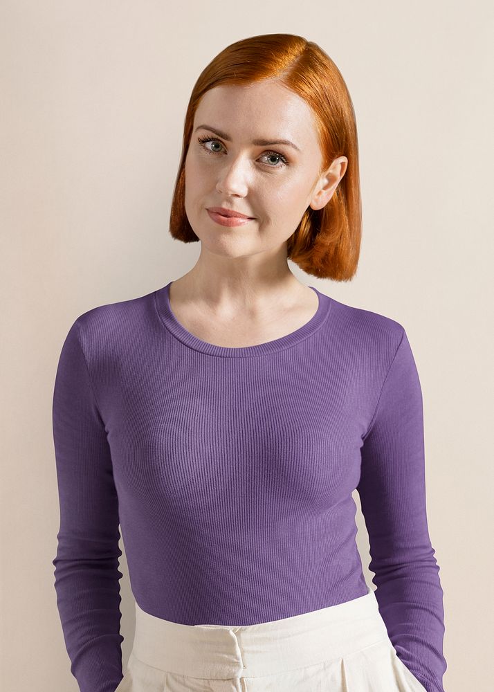 Ginger-haired woman wearing purple long sleeve, autumn apparel fashion design