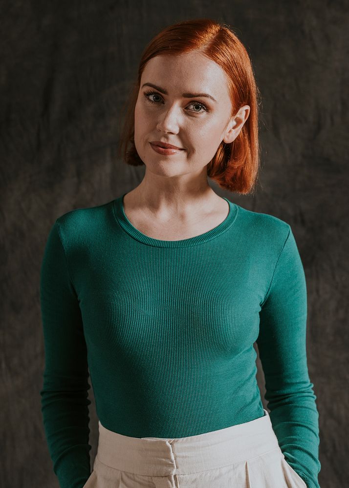 Cheerful woman in green long sleeve, autumn apparel fashion design