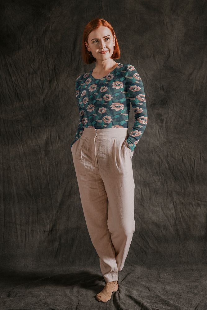 Woman wearing floral printed long sleeve with beige pants, autumn apparel fashion design
