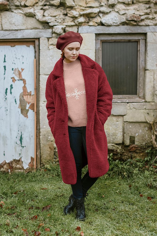 Woman in pink sweater and red coat
