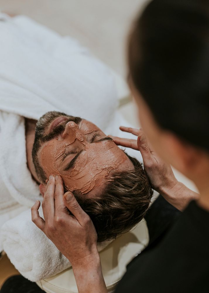 Man having facial massage in spa